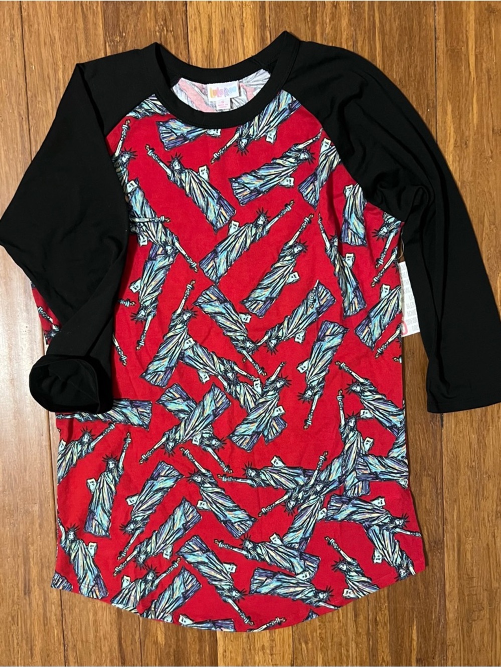 LuLaRoe Randy Black Raglan Tee with Multi-Color Logo Accent